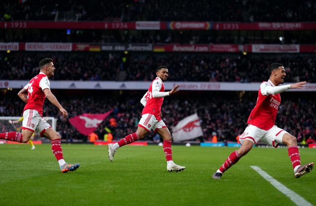 Reiss Nelson (centre) celebrates the winner
