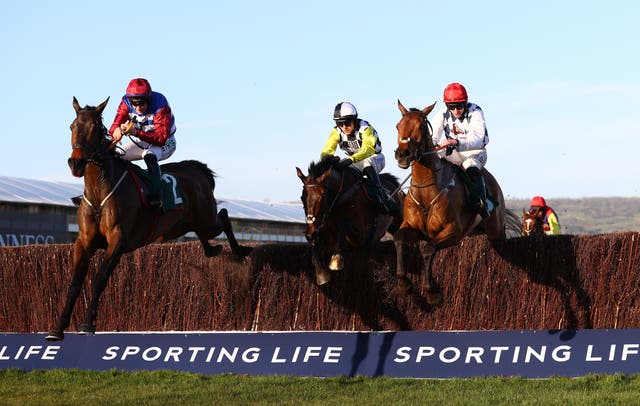 Escaria Ten (left) jumps a fence at Cheltenham, where he finished third in the National Hunt Chase in 2021