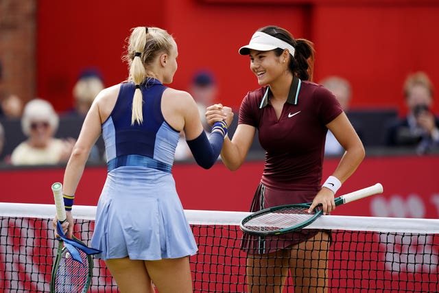 Emma Raducanu, right, shakes hands with Rebecca Sramkova after her last-16 win at Queen's Club