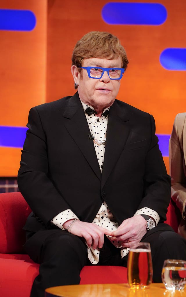 Elton John sitting on a sofa on the Graham Norton Show 