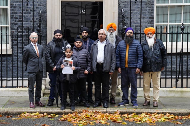 Members of the Free Jaggi Now Campaign hand a petition in to 10 Downing Street to mark five years of detention for Jagtar Singh Johal, or Jaggi, in 2022