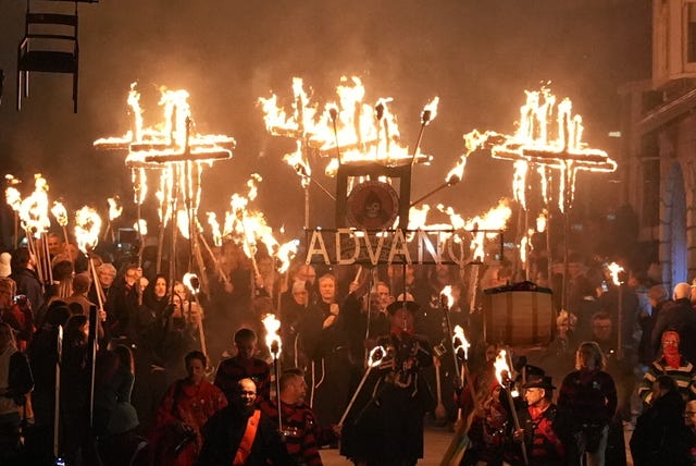 Participants during an annual bonfire night procession held by the Lewes Bonfire Societies