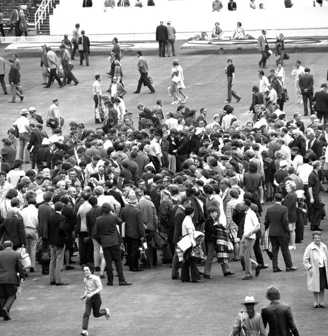 Fans inspect the Headingley wicket after England took a 2-1 lead in the 1972 Ashes series with a nine-wicket win. The series would finish in a draw