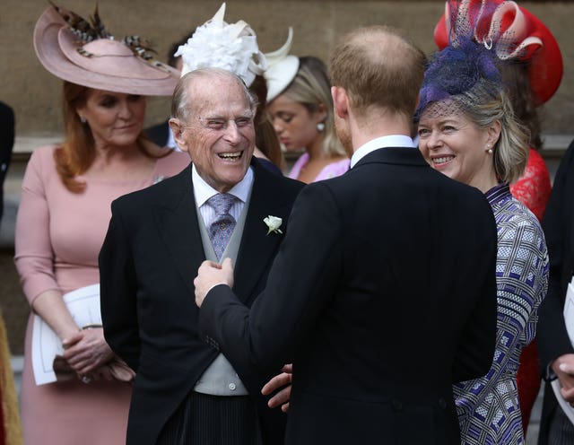 The Duke of Edinburgh speaking to the Duke of Sussex 