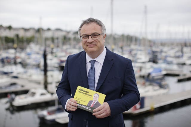 Stephen Farry, Alliance Party Westminster candidate for the constituency of North Down pictured at Bangor Marina holding a campaign flyer