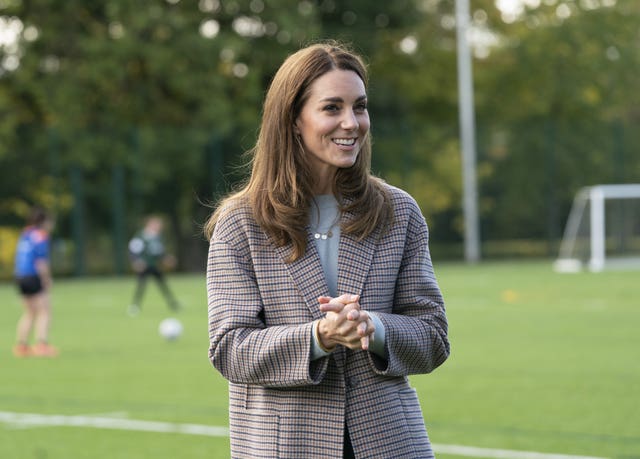 Kate watched the female football players and chatted to students. Arthur Edwards/The Sun