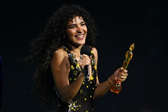 Olivia Dean with her Brit awards