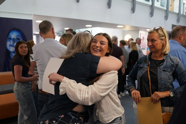 Katie Smallwood celebrates after getting her A-level results at Solihull School in the West Midlands