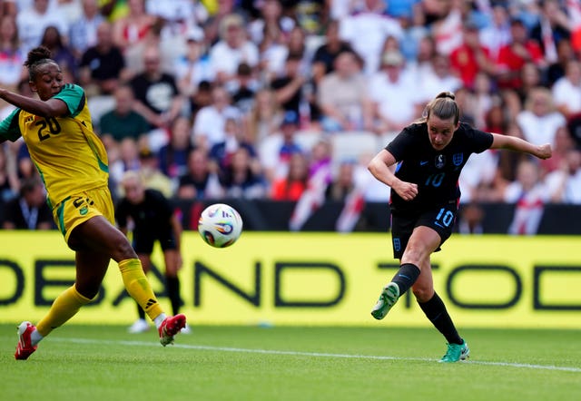 Ella Toone, right, scores for England against Jamaica