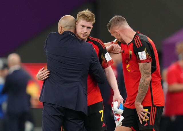 Roberto Martinez (left) consoles Kevin De Bruyne after Belgium exit the 2022 World Cup