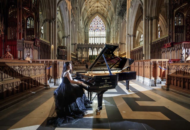 Ke Ma rehearses at York Minster ahead of a performance to highlight the plight of musicians and the arts