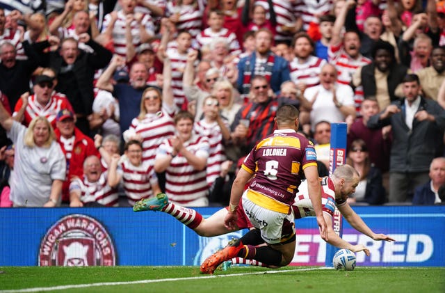 Wigan's Liam Marshall scores the decisive try to see off Huddersfield in the Betfred Challenge Cup final at the Tottenham Hotspur Stadium