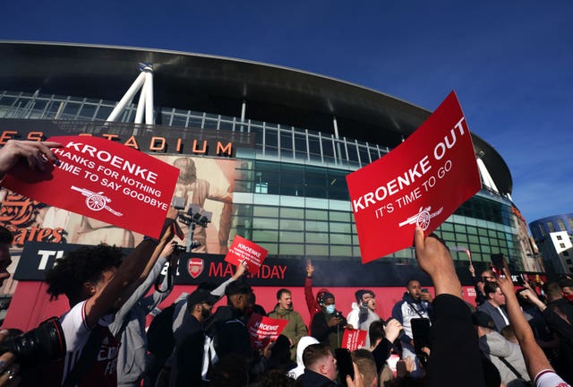 Fans protest against Arsenal owner Stan Kroenke before the Premier League match against Everton in April