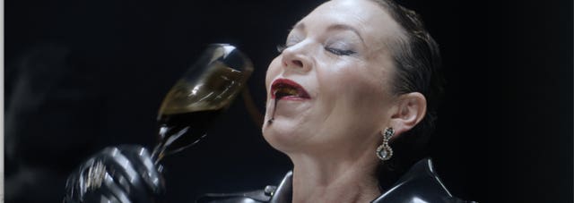 Olivia Colman dressed as a latex-wearing oil executive called Oblivia Coalmine in a new campaign video highlighting the role of pension funds in fossil fuel projects