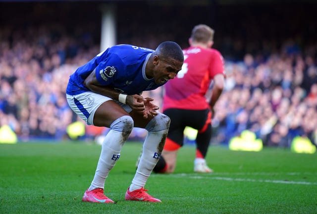 Everton’s Ashley Young reacts during the match, shouting as he bends over 