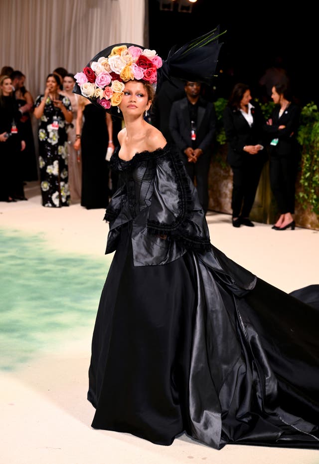 Zendaya in a long black dress and a hat at the Met Gala 