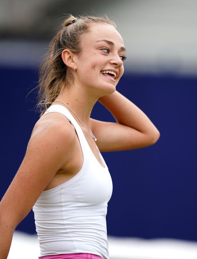 Isabelle Lacy smiles after beating Madison Brengle