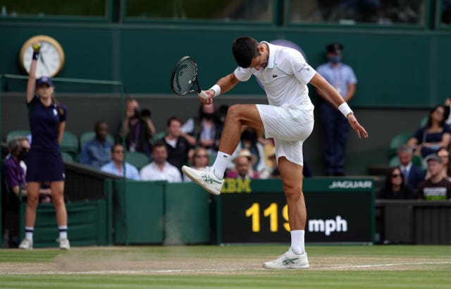 Novak Djokovic kicks the surface