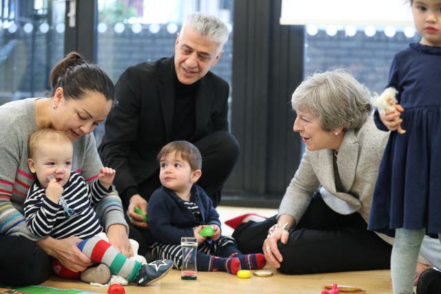 Theresa May joins a parent and baby group