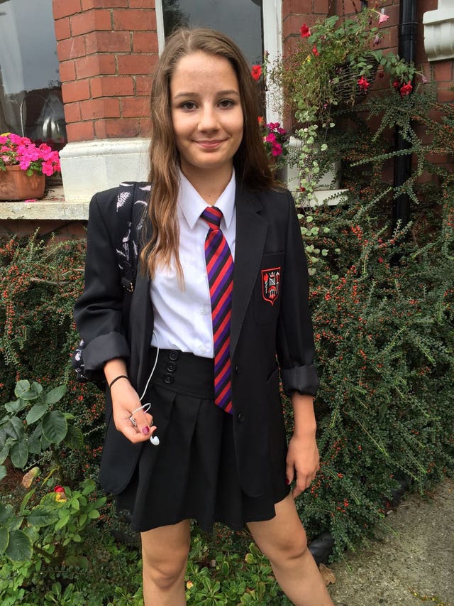 Handout photo of Molly Russell smiling, dressed in school uniform