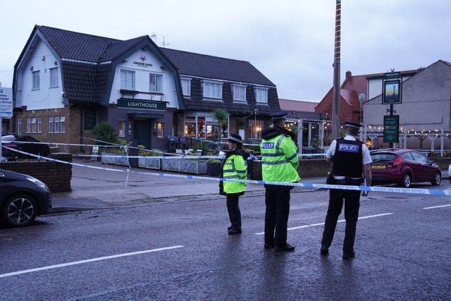 Police in front of pub