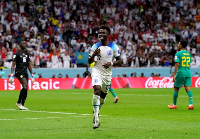 Bukayo Saka celebrates scoring against Senegal