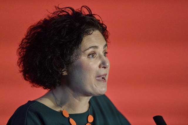 Side view headshot of Claire Hanna speaking