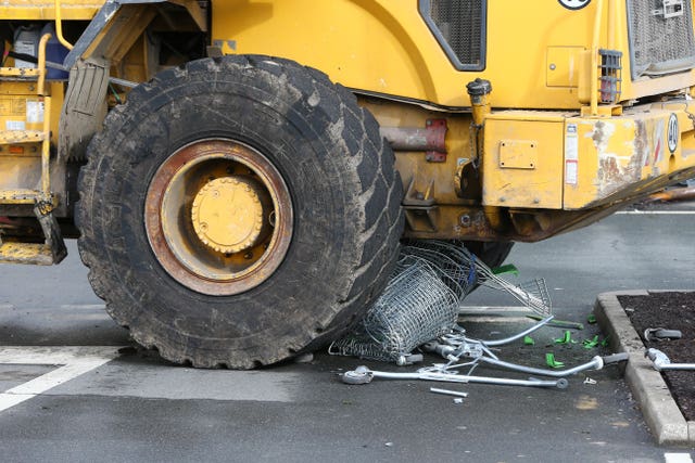 A shopping trolley was crushed under the digger 