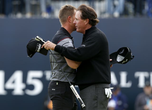 Henrik Stenson and Phil Mickelson embrace