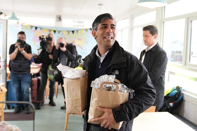 Rishi Sunak picking up breakfast for the media