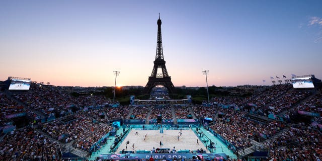 A view of the beach volleyball with the Eiffel Tower in the background. 