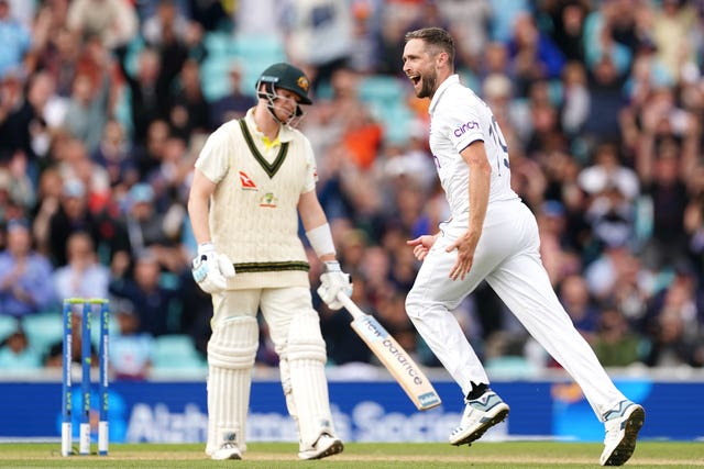 England's Chris Woakes, right, celebrates the wicket of Australia’s Steve Smith, left, at The Oval