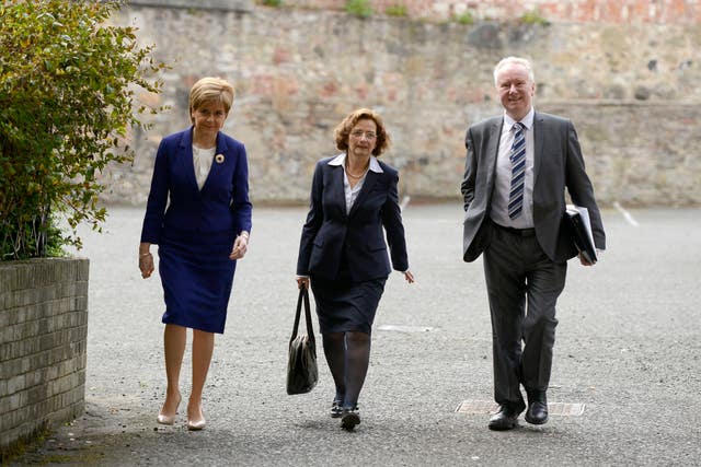Nicola Sturgeon and Alex Neil walking into a cabinet meeting