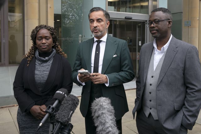 Kadi Johnson alongside Aamer Anwar, who is making a statement