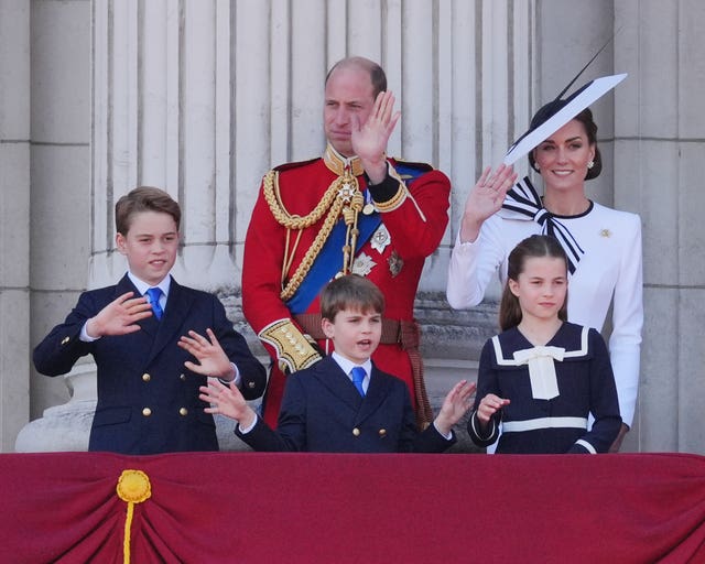 The Wales family wave from the balcony during the Trooping the Colour celebrations