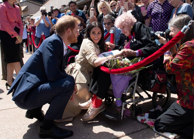 The royal couple crouched down to speak with Mrs Dunne (Paul Edwards/The Sun/PA)