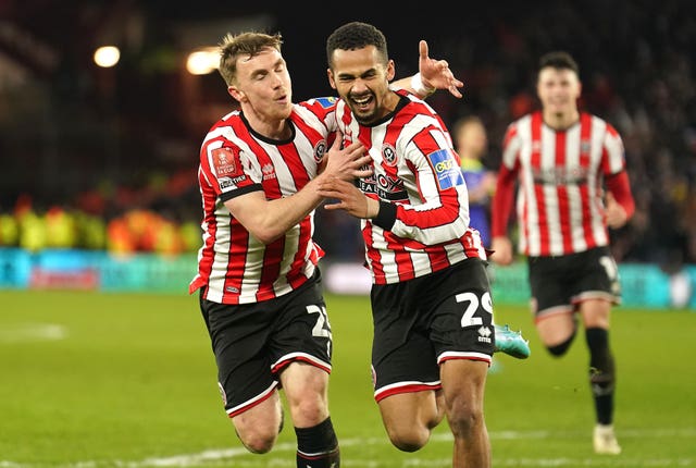 Sheffield United's Iliman Ndiaye (right) celebrates his winner against Tottenham