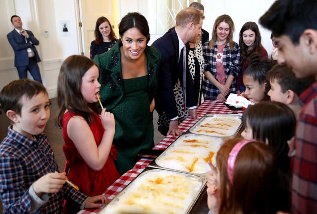 The Duke and Duchess of Sussex watch a demonstration of a Canadian spring tradition of making maple taffy