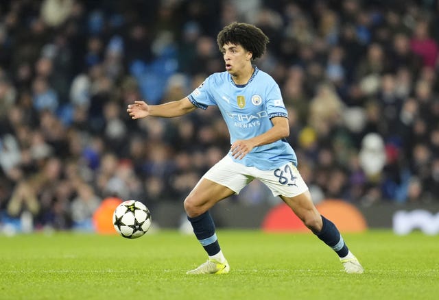 Manchester City’s Rico Lewis reacts to a bouncing ball during a game