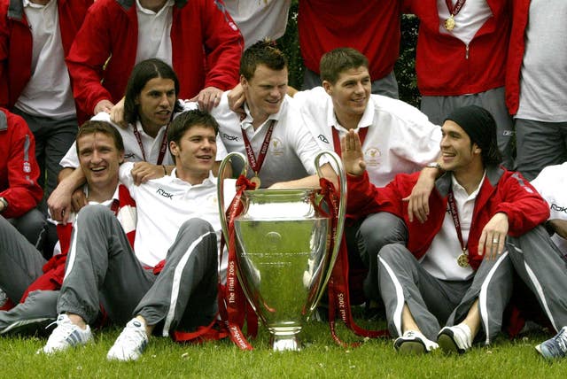 Liverpool players celebrate with the Champions League trophy in 2005