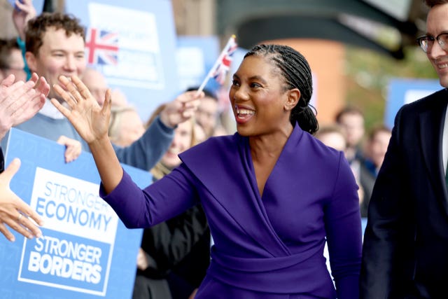 Kemi Badenoch waves at Tory activists as she arrives at the 2025 Conservative party conference