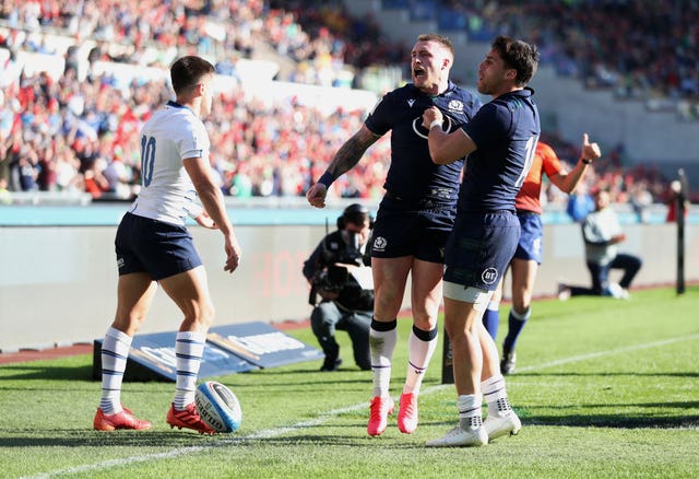 Stuart Hogg (centre) answered his critics with a try in Rome