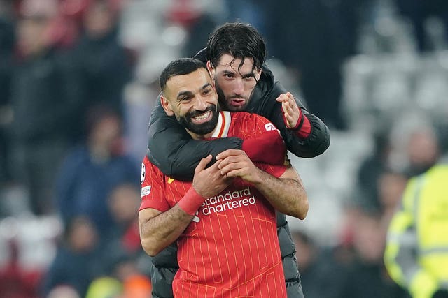 Mohamed Salah is congratulated by team-mate Dominik Szoboszlai, rear, after the final whistle