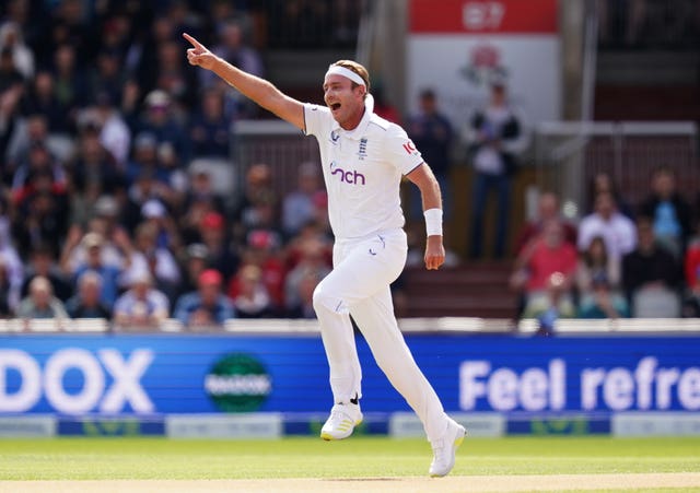 Stuart Broad celebrates taking the wicket from Usman Khawaja