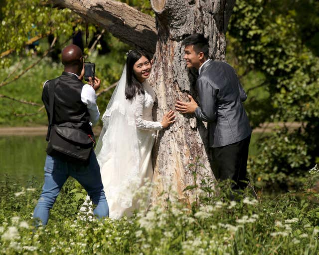 It was the perfect day for one newly-wed couple to have their photos (Yui Mok/PA)