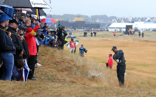 Spectators had a narrow escape from Tiger Woods' second shot at the second.