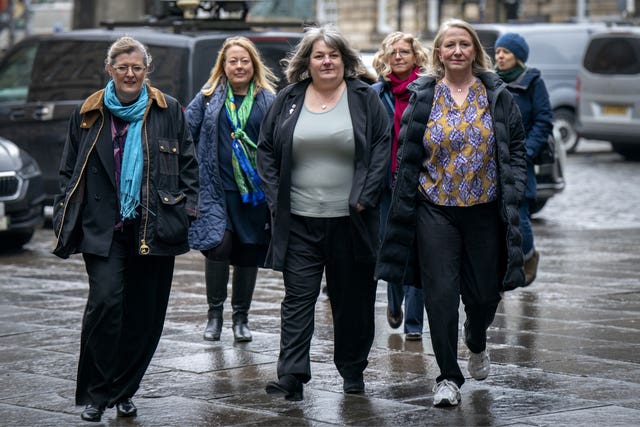 Members of the For Women Scotland group arrive at court width=