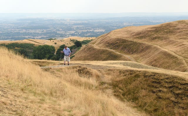 The heatwave left the countryside, such as the Malvern Hills, parched (Joe Giddens/PA)