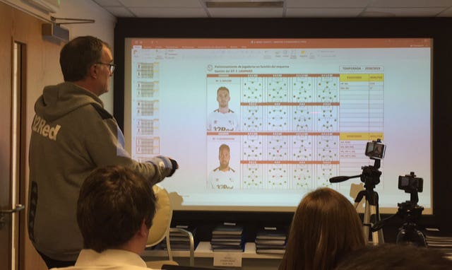 Leeds manager Marcelo Bielsa gives a PowerPoint presentation to the media