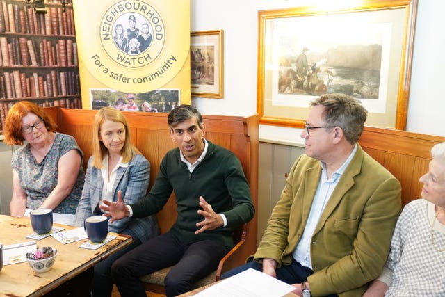 Prime Minister Rishi Sunak attends a Neighbourhood Watch meeting at the Dog & Bacon pub in Horsham, West Sussex, while on the General Election campaign trail